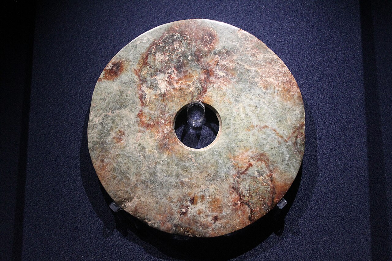 Neolithic Liangzhu culture jade bi disc with central perforation and smooth polished surface