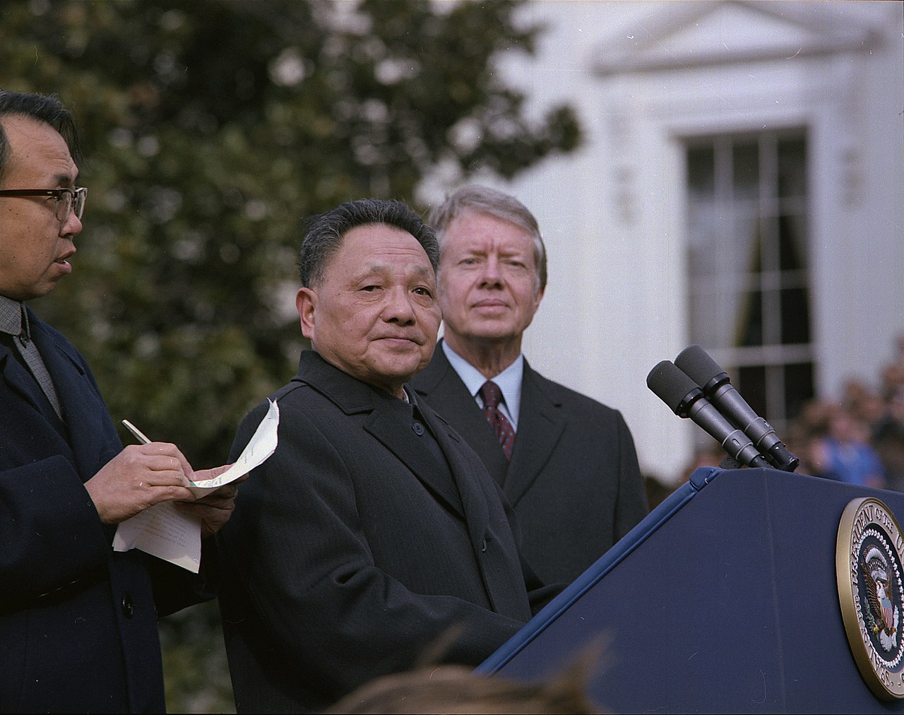 Deng Xiaoping speaking at the White House podium alongside President Jimmy Carter in 1979