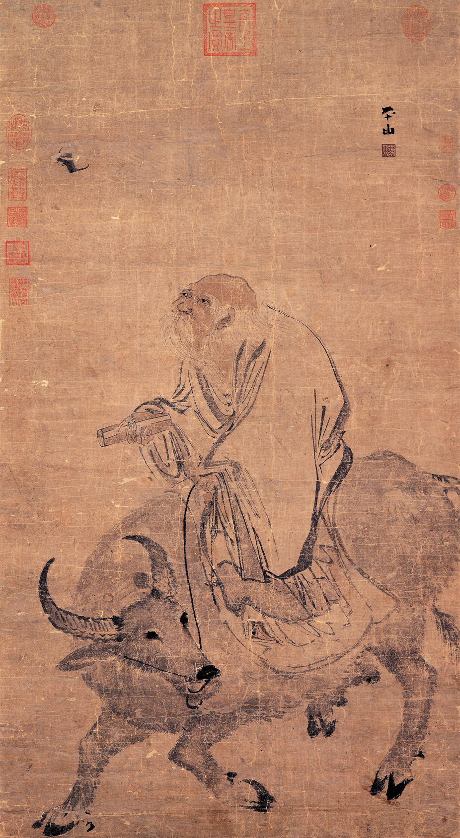 Traditional Chinese painting depicting Laozi riding a water buffalo through a mountainous landscape