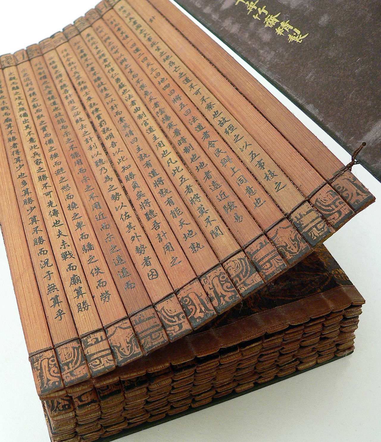 Ancient bamboo strips with Chinese characters showing an early manuscript of The Art of War