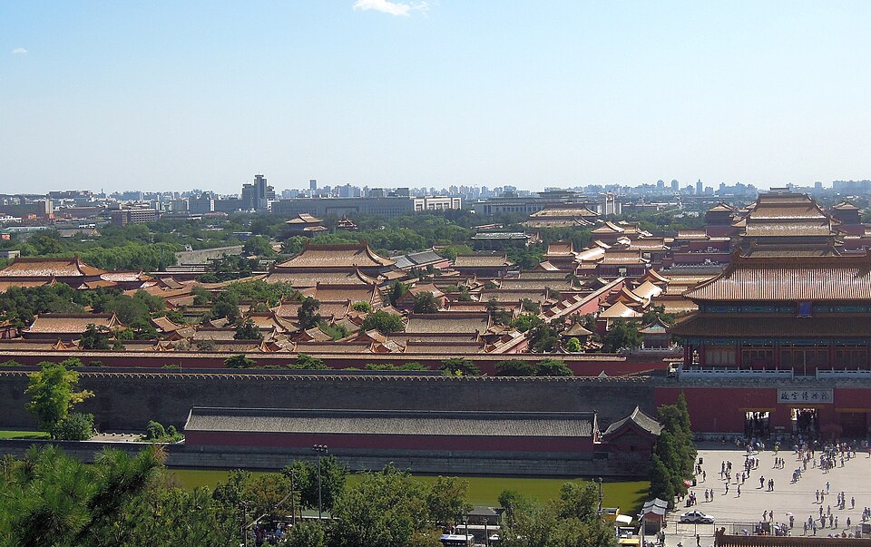 Elevated view of the Forbidden City from Jingshan Park showing golden roofs, red walls, and symmetrical layout