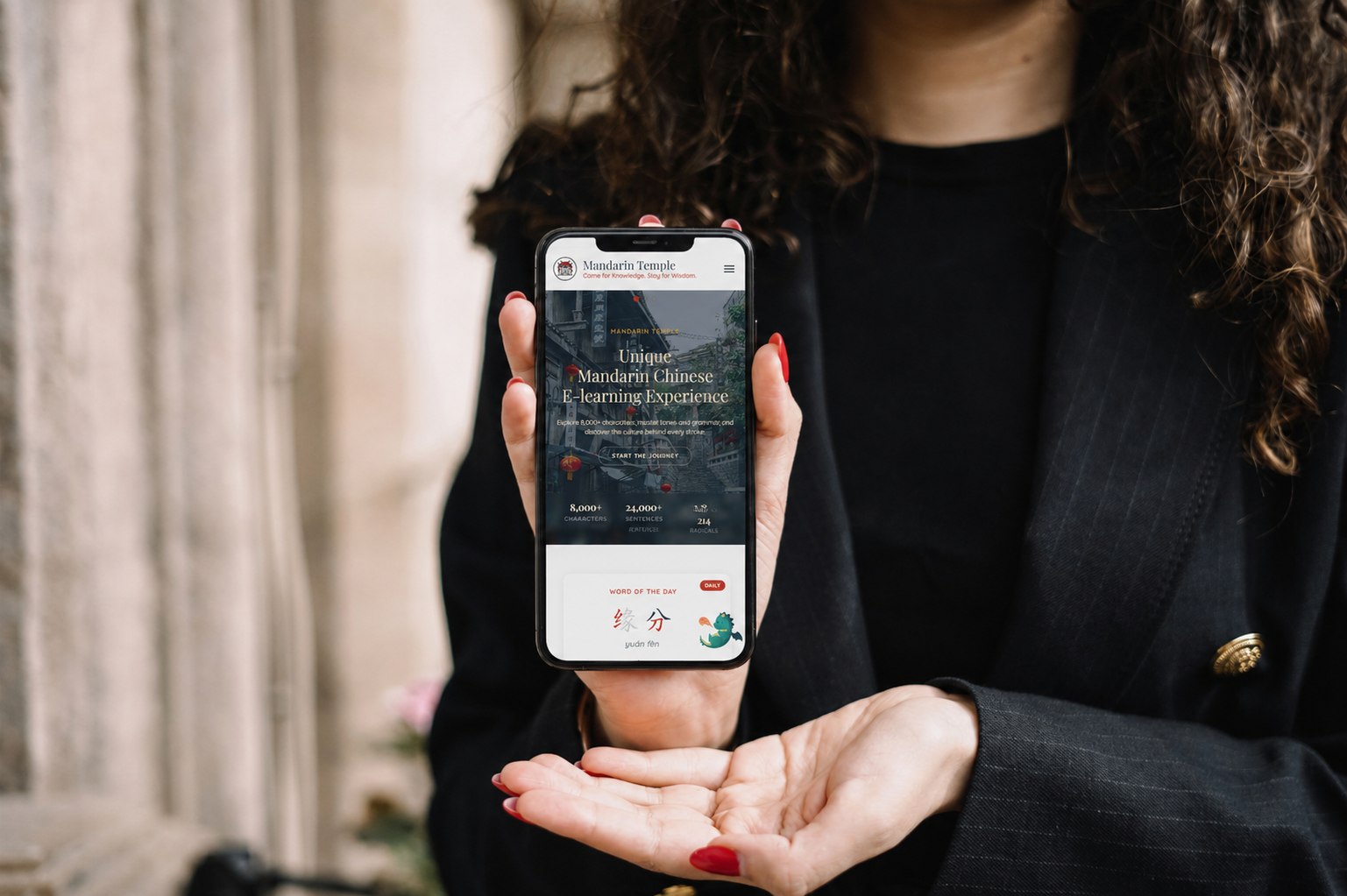 Mandarin Temple shown on a phone held in hand